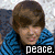A four- of pixelated images showing a person in various poses with a black banner reading 'peace.love.' across the middle