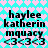 Pixelated text and symbols on a heart-patterned background with color variations between frames.