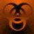 A pixelated image split into two sections: a brown-toned face on the left and green text on the right.