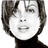 Static 48x48 pixel icon showing a stylized grayscale portrait of a person with short dark hair and a black top, rendered in low-resolution dithering style against white background.