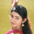 Static 50x50 pixel icon showing a person with dark hair in a ponytail wearing a pink top against a yellow background, rendered with visible dithering and low-resolution artifacts.