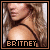 Pixelated close-up of a person with long wavy light brown hair wearing a dark strap top, text 'BRITNEY' at bottom in blocky font.
