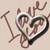Pixelated static icon with abstract brown and white shapes on a light beige background, featuring curved lines forming an irregular heart-like outline with internal swirls.