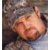 A contact sheet of two animated frames showing a person lying down on the left and red text "Larry the Cable Guy" on the right against a black background.