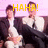 Two men in dark suits sit on a couch with pink background; yellow text reads 'HAHA!' above and 'YOUR FACE' below.
