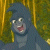 Pixelated cartoon character with blue body and hat, wide eyes, open mouth showing pink tongue, set against vertical yellow and green striped background.