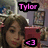 Pixelated image of a person with curly brown hair holding a red object, with pink text 'Tylor' above and a pink heart symbol below.