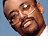 Animated contact sheet of a Black man with glasses smiling against blue background, showing sequential frame variations in facial expression and text overlays.