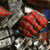 Animated sequence of a red and silver armored figure with clenched fists, transitioning to a blue background with white stylized '2' symbols.