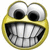 Pixelated circular icon with yellow border, large white eyes with black pupils, and wide toothy grin showing multiple teeth.