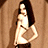 A 48x48 pixel animated buddy icon featuring a cartoon woman in a white top and dark pants against a brown background, with green text reading "Original Icons .com" on the right side of the contact sheet.