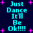 Pixelated cyan text "Just Dance It'll Be Ok!!!!" on dark blue background with pink starbursts, repeated in two