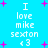 Pixelated blue background with pink plus signs and white text reading 'I love mike sexton <3' in two vertical