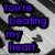 Pixelated text reads "You're beating my heart." in purple letters on black rectangular backgrounds against a gray and white pixelated backdrop.