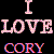 Pixelated text reads "I LOVE CORY" in three lines on a black background, with the top line as a single letter and middle/lower lines as full words.