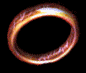A circular ring with glowing orange and white edges rotates clockwise against a black background, showing of motion