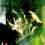 Green foliage with bright white and yellow highlights against a dark background, showing subtle pixel-level variations across two adjacent frames.