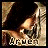 A pixelated close-up of a character's face with dark hair and light skin, showing text below the image in two color variations.