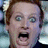 A pixelated image of a person with light brown hair and wide eyes, mouth open in shock or surprise, overlaid with red text reading 'keep yer Cool' on the right side.