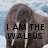 A pixelated static image shows a walrus with tusks against a light blue sky background, overlaid with bold black text reading "I AM THE WALRUS".