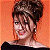 A pixelated contact sheet showing two frames of an animated icon featuring a woman with styled hair against an orange background and green text reading "Original Icons .com" on the right side.