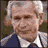 nine pixelated images showing a man in a suit with changing text overlays and one image of a man with a white head covering