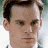 A 48x48 pixel animated buddy icon featuring a split-frame contact sheet with two distinct visual elements: a close-up of a person's face on the left and text/logo imagery on the right, displayed as part of an animation sequence.