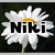 A pixelated daisy with white petals and a yellow center, overlaid with bold black text reading 'Niki' on the left side of the flower.