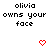 Pixelated text 'olivia owns your face' appears above red heart and downward arrow symbols in a