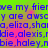 Pixelated text repeats across a bright green and pink gradient background with blue lettering.