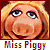 Pixelated static image of a cartoon pig character with blonde hair and blue eyes, labeled "Miss Piggy" in colorful text below the face.