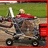 Pixelated image of a person in a red shirt riding a shopping cart on a paved path with grass in the background.