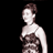 Static pixelated image of a person in a strapless dress against black background with visible dithering and grayscale tones.