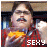 A 48x48 pixel animated buddy icon featuring a character in a red shirt holding yellow food, with