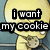 Pixelated yellow cartoon character with large eyes and a small mouth, holding a cookie, with text overlay reading 'i want my cookie' on the left side.