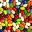 Pixelated image of colorful jelly beans with text labels 'JELLY', 'BEAN', and 'LOVER' on a black background.