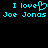 Pixelated cyan text on black background displays "I love Joe Jonas" with a heart symbol replacing the 'o' in love, repeated twice side-by-side.
