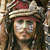 A pixelated close-up of a person wearing a light-colored hat with a dark band and a red brim, long dark hair, and a neutral expression.
