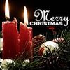 Two red candles with flickering flames sit on a bed of greenery and pine cones beneath 'Merry Christmas' text.