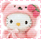 Pink cartoon character in pink hooded outfit with rose on ear, yellow beak-like nose, black eyes, and white face against light checkered background.