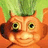 Animated orange cartoon character with green spiky hair and large green eyes, smiling with one eye partially closed in a wink.