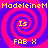 Pixelated spiral pattern with alternating pink and purple rings, yellow text elements arranged in a