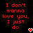 Red pixelated text on black background reads "I don't wanna love you, I just do" with two red-and-white heart icons below the right side of the text.