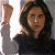 A contact sheet of two animated frames showing a woman with long brown hair and glasses raising her arm, next to green text reading "Original Icons .com" on a dark background.