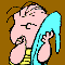 Animated cartoon character with pink skin and gray hair holds a blue object, wearing yellow striped shirt against brown background.
