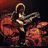 Pixelated image of a person with a halo playing drums, with red text reading "Jimmy Page Rocks!!" on the right side.