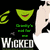 Pixelated green cartoon character with red mouth, white hair, and black clothing against a dark background; text "Wicked" in large blocky letters below.