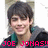 Pixelated image of a person with dark hair wearing a teal and black jacket, smiling slightly against a light background.
