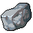 Pixelated icon of a translucent blue-gray gemstone with internal light reflections and dark shadowed edges on a gray background.
