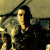 A split-frame contact sheet showing a pixelated image of a person on the left and green text reading "Original Icons .com" on the right, with visible dithering and low-resolution artifacts.